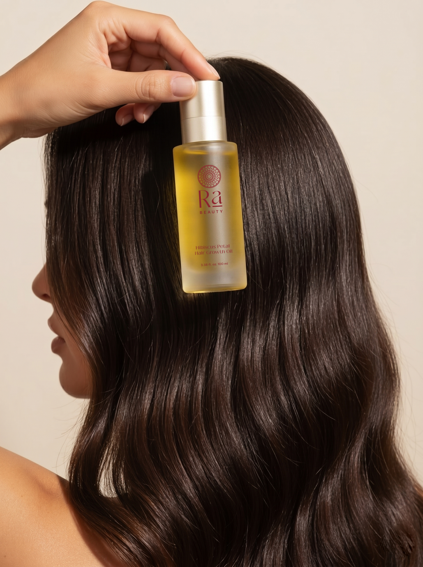 Ra Beauty hair oil being applied