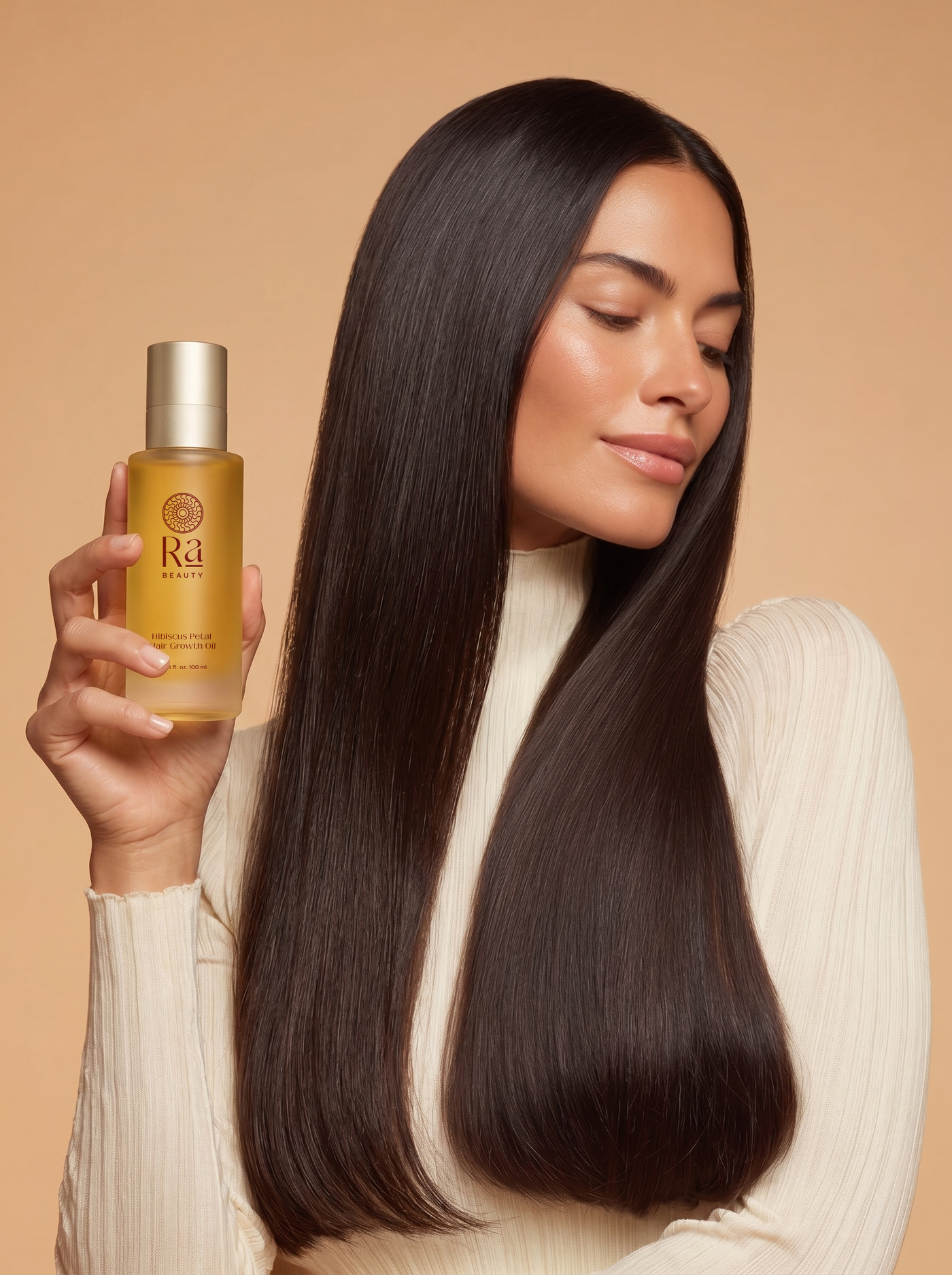 Woman holding Ra Beauty Hibiscus Petal Growth Oil
